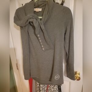 Micheal Kors loose Turtle Neck sweater, Grey in color, Sized Small